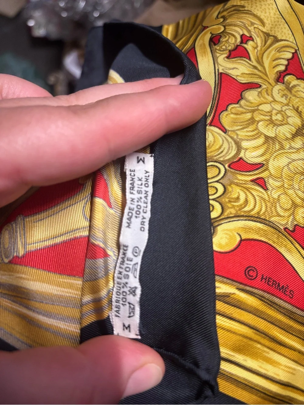 Hermès silk scarf in gold, red and black ornate print
